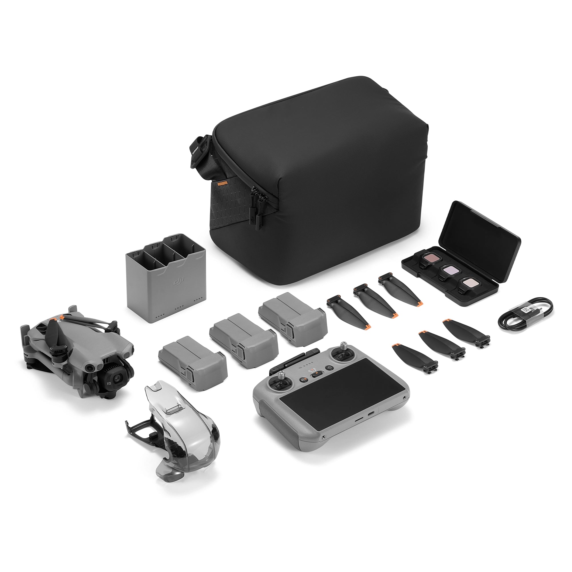 DJI Mini 5 Pro Fly More Combo with RC 2 controller contents on a white background